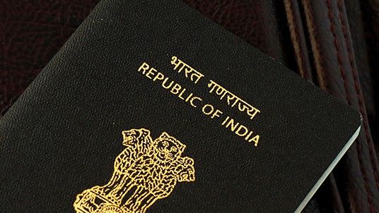 indian national passport on a traveling bag